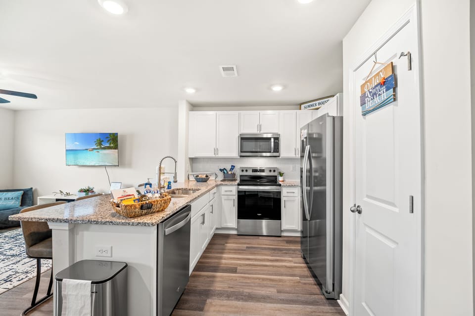 Well-equipped kitchen with stainless appliances and granite counters