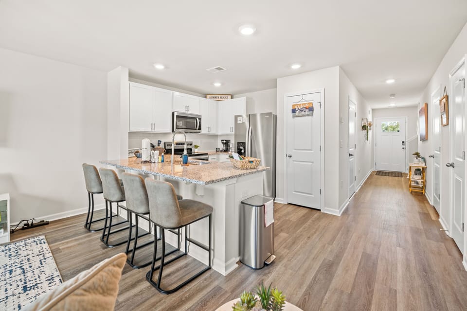 Granite breakfast bar with seating for four — perfect for casual meals