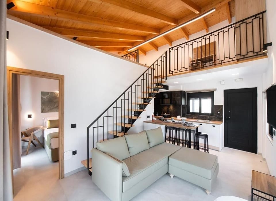 Superior Suite, Balcony, Pool View | Living area | TV