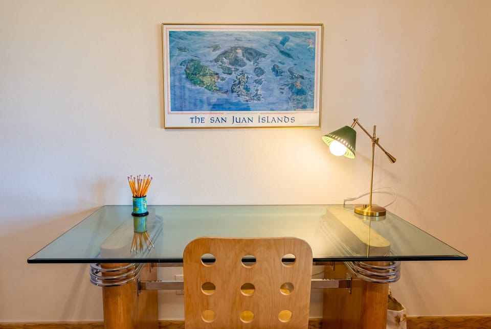 Working remotely? The dedicated office provides a quiet workspace without sacrificing the home's peaceful treehouse setting.