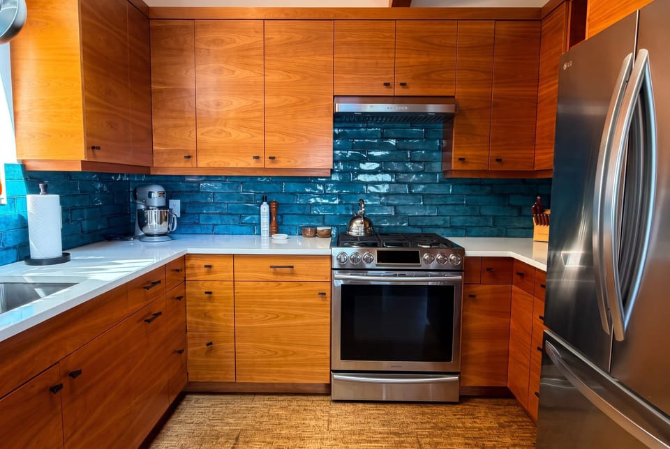 Designed for people who actually cook, the kitchen is fully stocked with quality cookware, small appliances, and everything needed to feel at home.