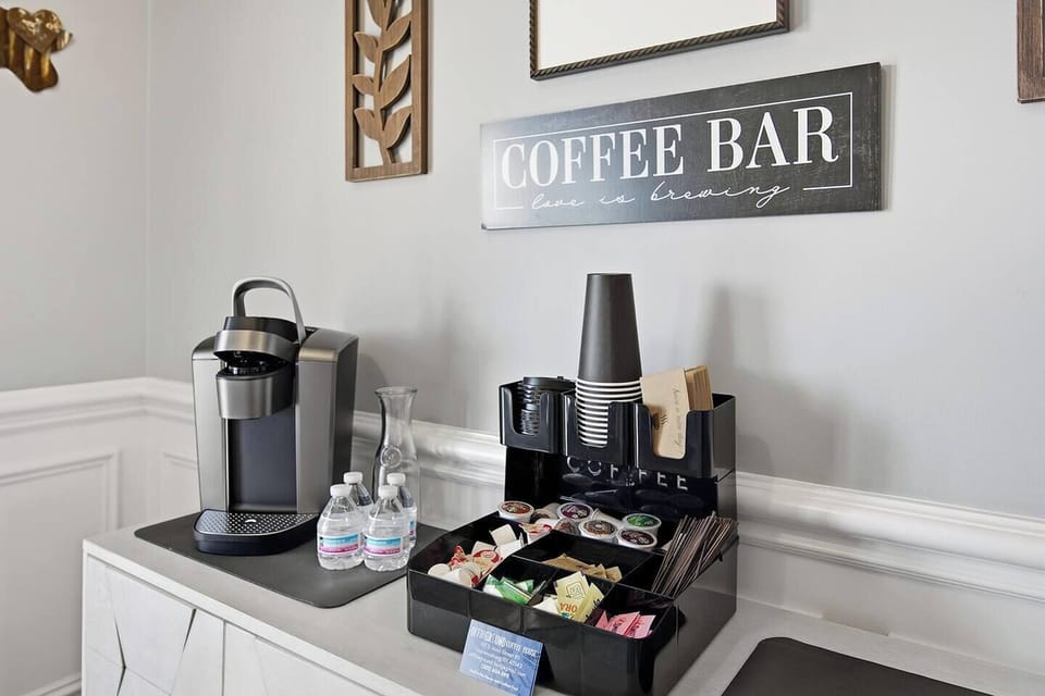2nd Floor Coffee Bar with Kuerig coffee maker.  A variety of K-cups, disposable cups, sweeteners and creamers provided!