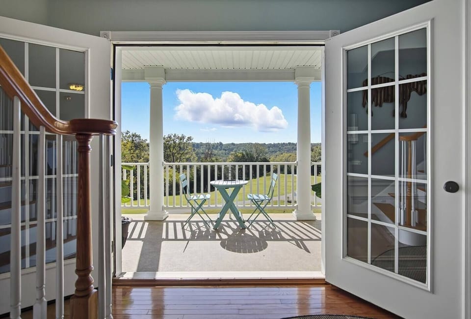 The first floor porch and second floor balcony are both beautiful spots to enjoy your coffee and the sunrise!