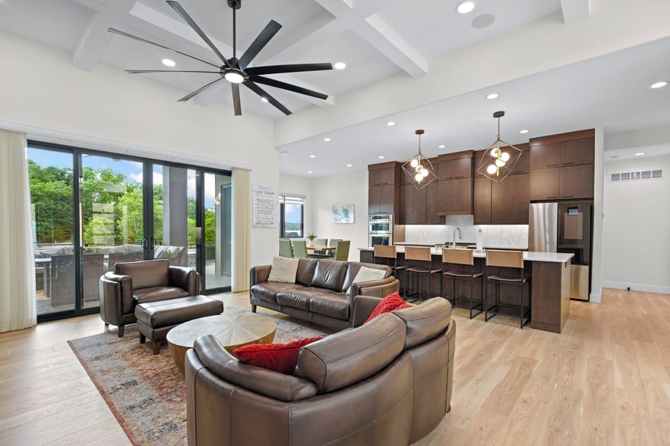 Main Level Living Room, Kitchen with view of Deck