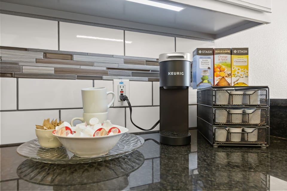 Start your mornings right with a convenient coffee and tea station, offering a Keurig brewer and a selection of beverages for every guest.