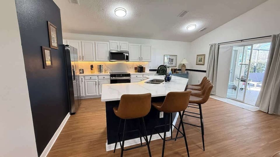 Cook with confidence in this updated kitchen featuring all-new appliances and supplies to serve 20+ guests. Pots, pans, bakeware, platters, and glassware are all ready for your “Be Our Guest” dinner.