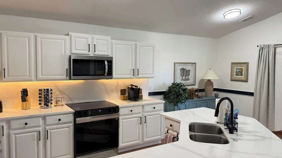 Completely stocked fully equipped kitchen for all the chef's in the family!  Ample supplies for large families!