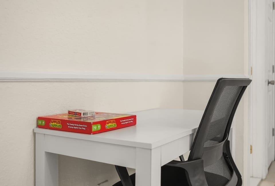 Dedicated workspace with comfortable seating and high-speed WiFi, providing the perfect setup for remote work, school assignments, tournament planning, or staying connected during your Disney-area vacation in Kissimmee.