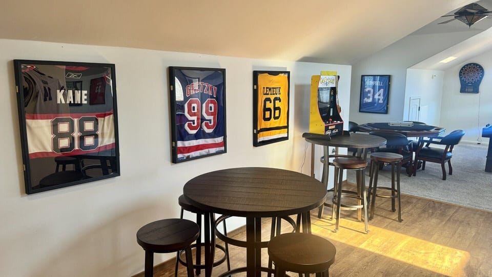 Game Room with poker table and <s. Pac Man game