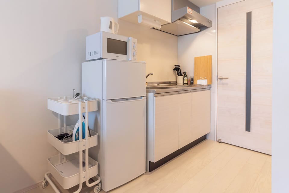 Standard Apartment, Lanai, City View | Private kitchen | Full-size fridge, microwave, stovetop, cookware/dishes/utensils