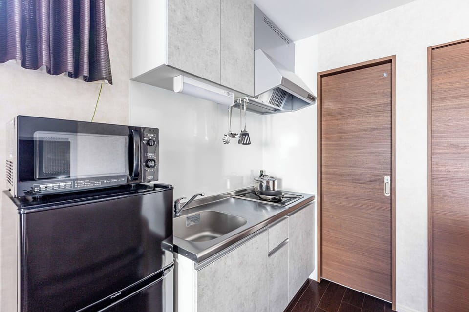 Standard Apartment, Lanai | Private kitchen | Full-size fridge, microwave, stovetop, cookware/dishes/utensils