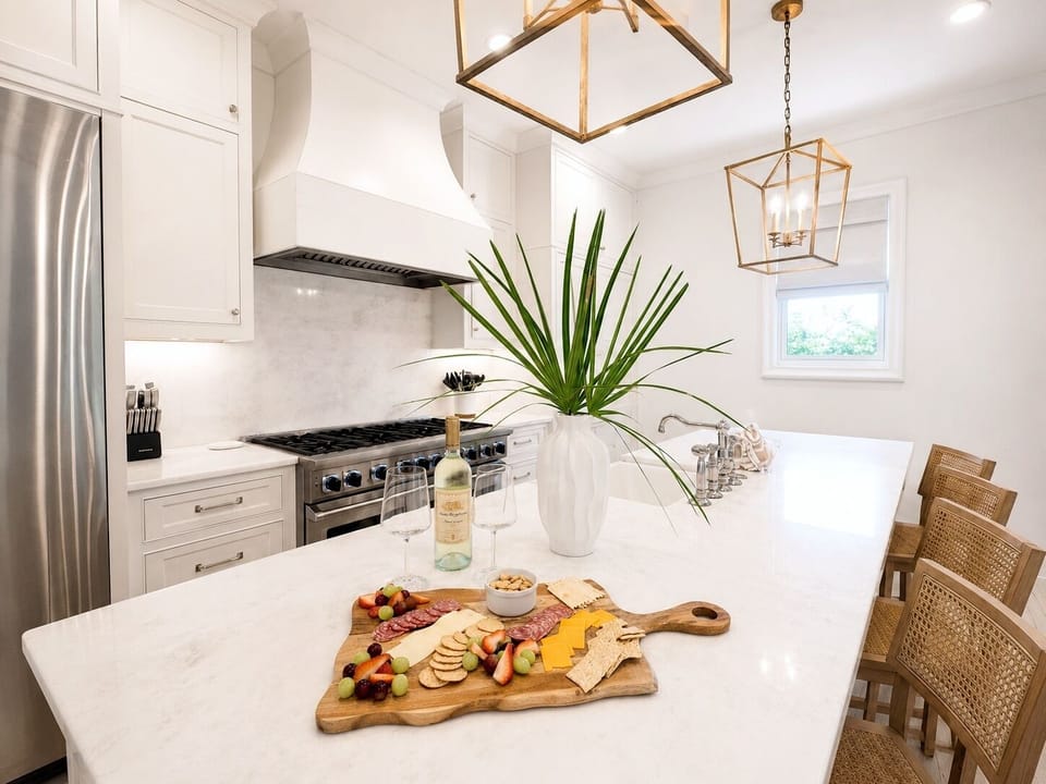 The island — quartz tops, coffee bar, seating for the whole crew