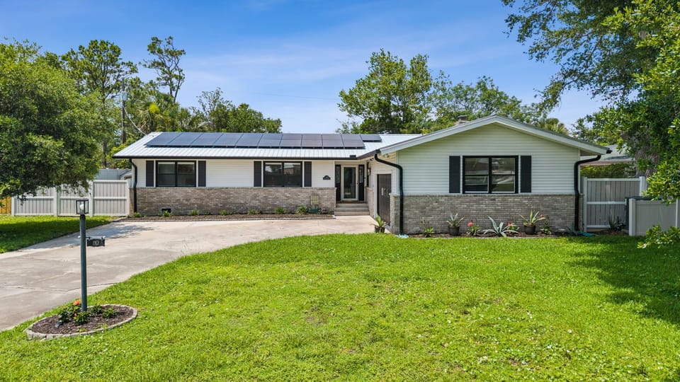 Located in St. Augustine Beach - Single story home with 40ft x 8ft lap pool, screen covered backyard and side yard. Sleeps 10 people across 2,087 sq ft, 3BR/2BA.