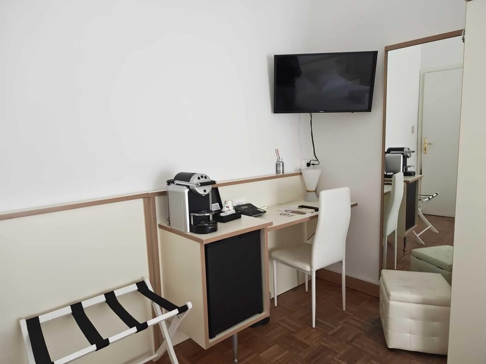 Standard Double Room | Minibar, in-room safe, desk, blackout drapes