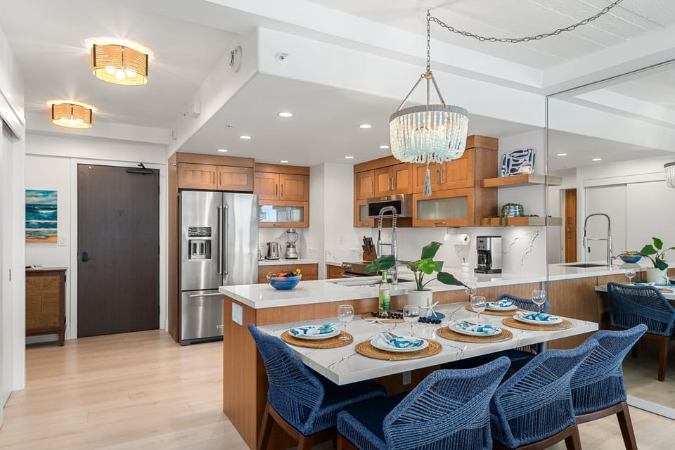 Enjoy meals in this beautifully designed dining area with statement lighting and seamless flow into the upgraded kitchen.
