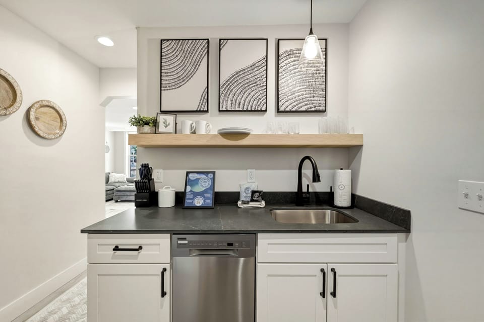 Sleek design meets everyday convenience. ☕🖤 Whip up a quick snack or brew your morning coffee in this beautifully styled kitchenette.