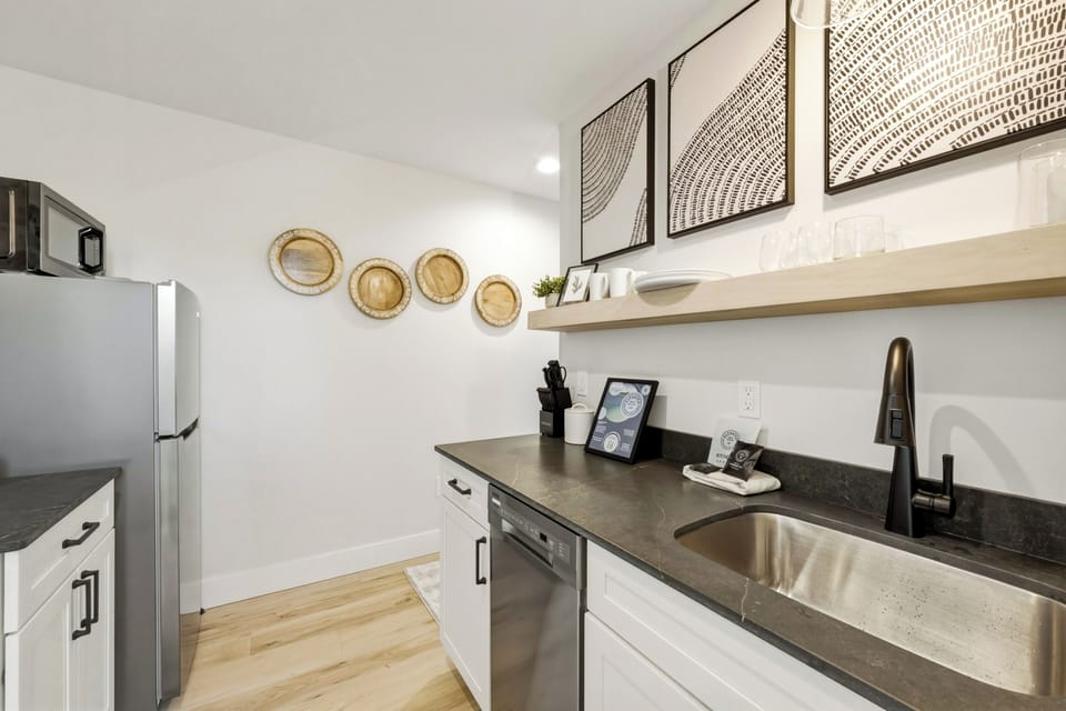 Streamlined, spotless, and stocked with stainless steel appliances.