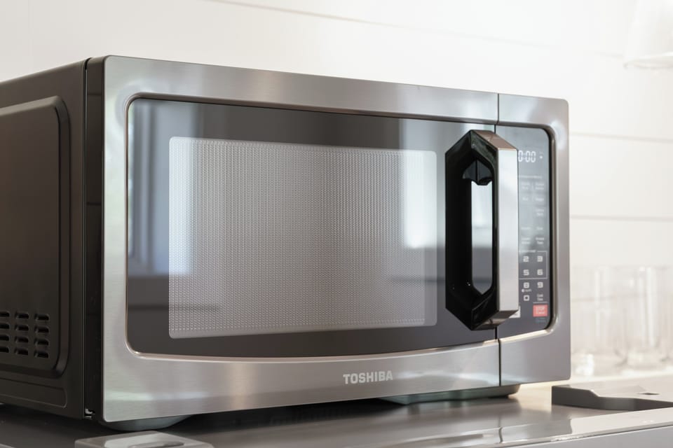 A fully equipped kitchen includes modern appliances and convenient essentials to make meals and snacks a breeze.
