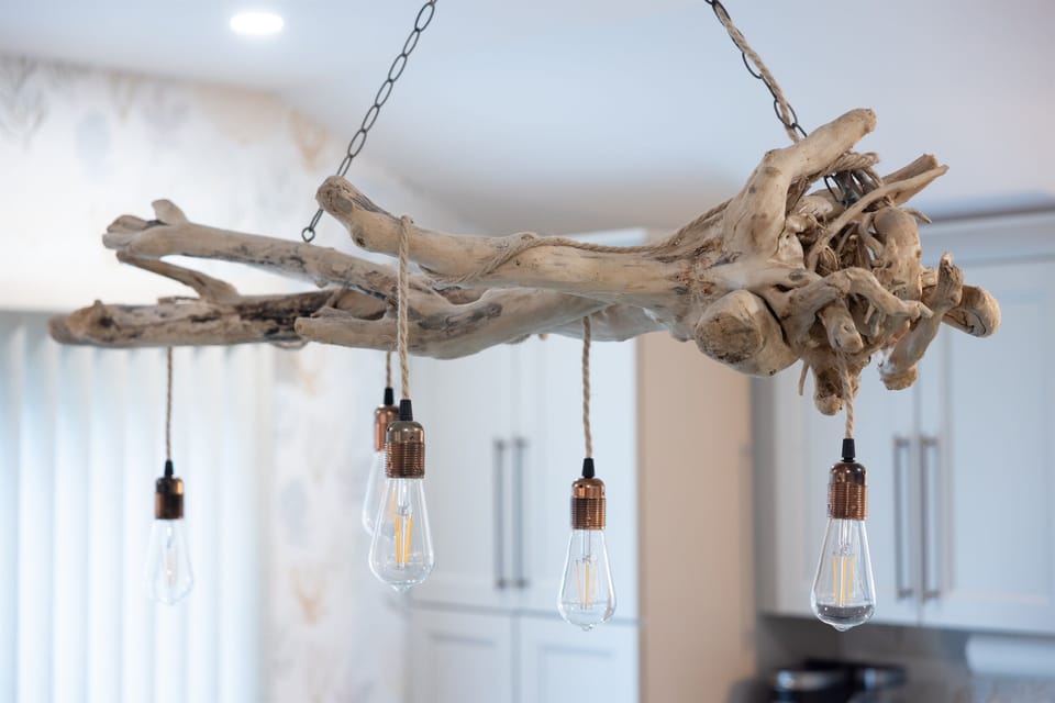 Driftwood chandelier above the kitchen island