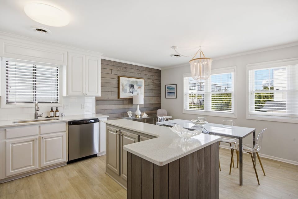 Bright kitchen and dining area with stylish coastal touches and plenty of room to gather together