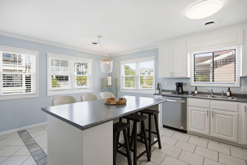 Open-concept kitchen and dining area designed for gathering, entertaining, and making memories
