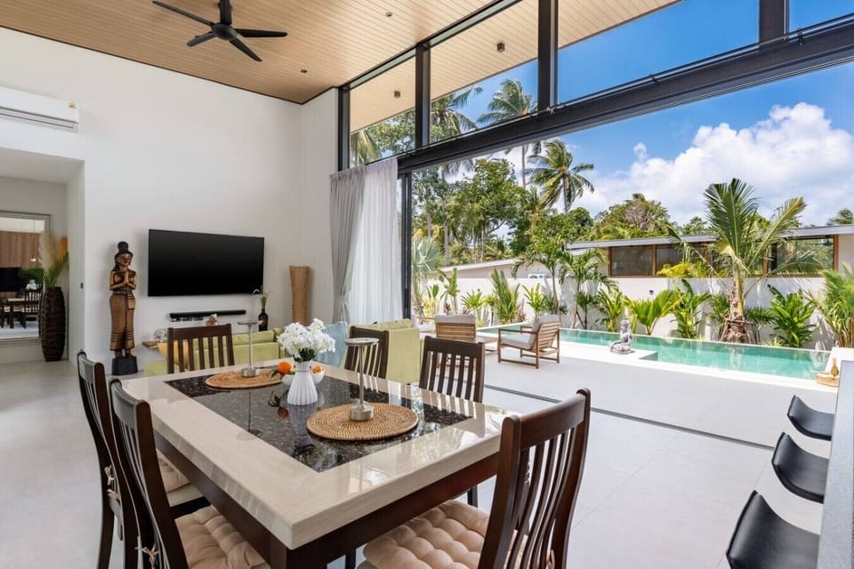 Covered dining terrace seats the whole group and overlooks the pool for easy supervision.
