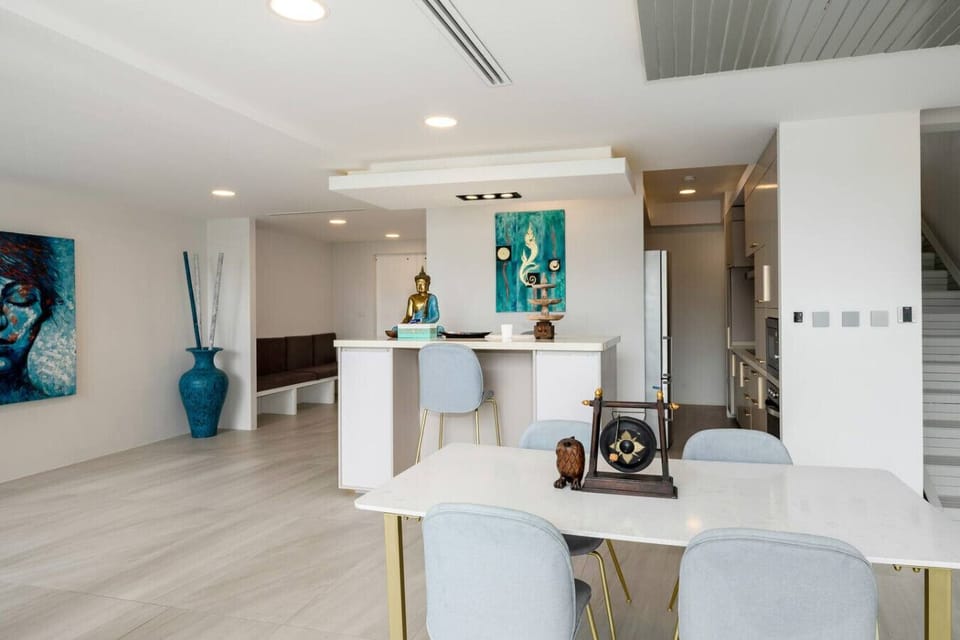 Spacious living and dining area with sea views at Villa J3, Replay Residence Bangrak Koh Samui