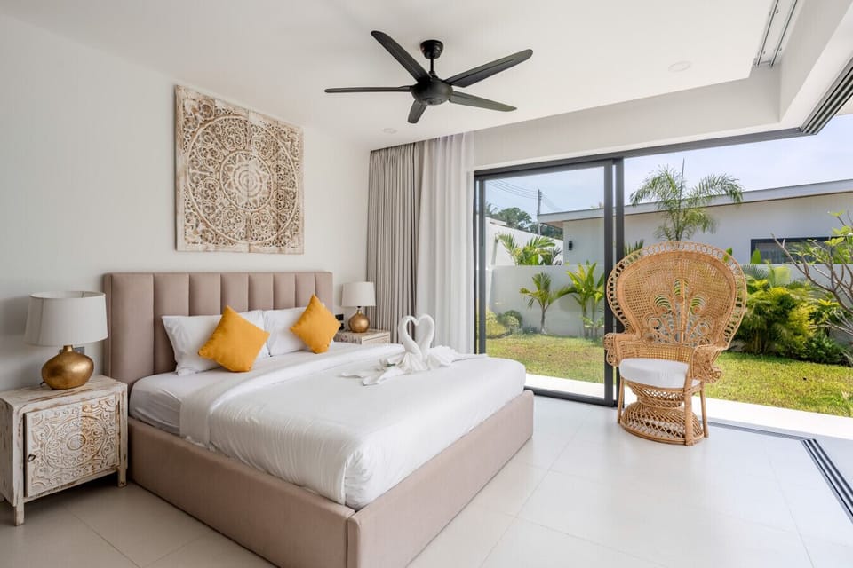 Spacious modern bedroom with garden views at Sawasdee Pool Villas, Koh Samui