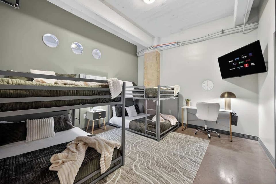 "Four queen beds means real comfort - not squeezing into twin bunks like summer camp, but actual adult sleeping space downtown.