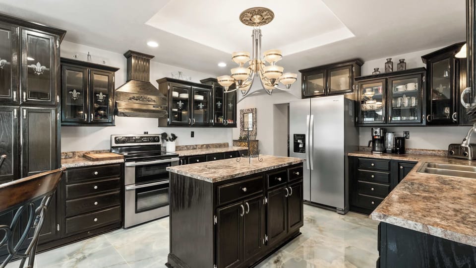 The elegant kitchen offers ample space & all the comforts of home​