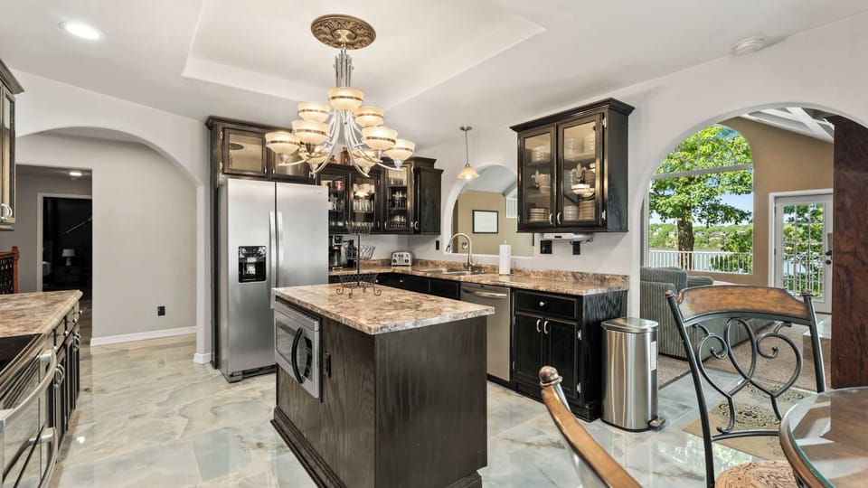 The elegant kitchen offers ample space & all the comforts of home​
