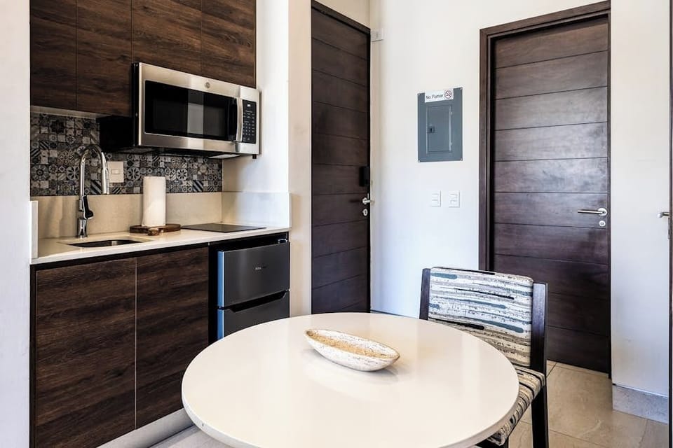 Studio, 1 Queen Bed, City View (Carmely Velas Paradise # 2403A) | Private kitchen