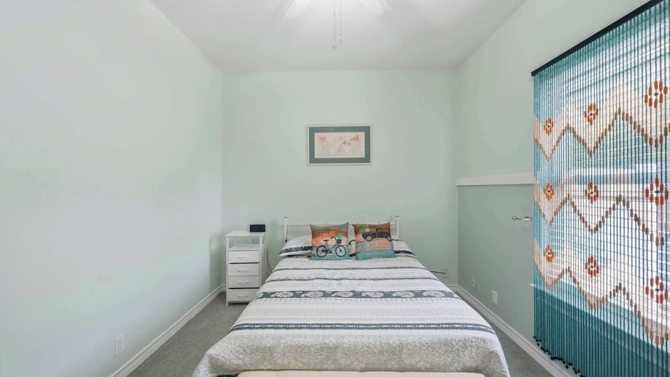 This cozy second bedroom is ready for your favorite travel buddy, whether they walk on two legs or four paws.