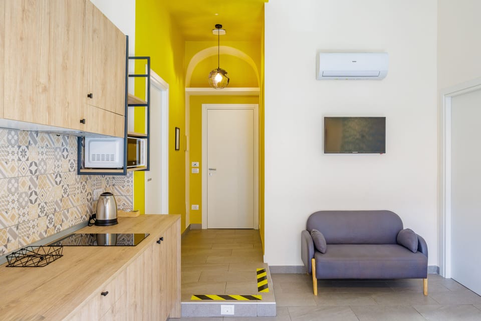 Apartment (2 Bedrooms) | Living area | 32-inch Smart TV with cable channels