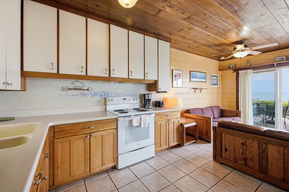 Cook, gather, and enjoy Lake Michigan views just beyond the living room.