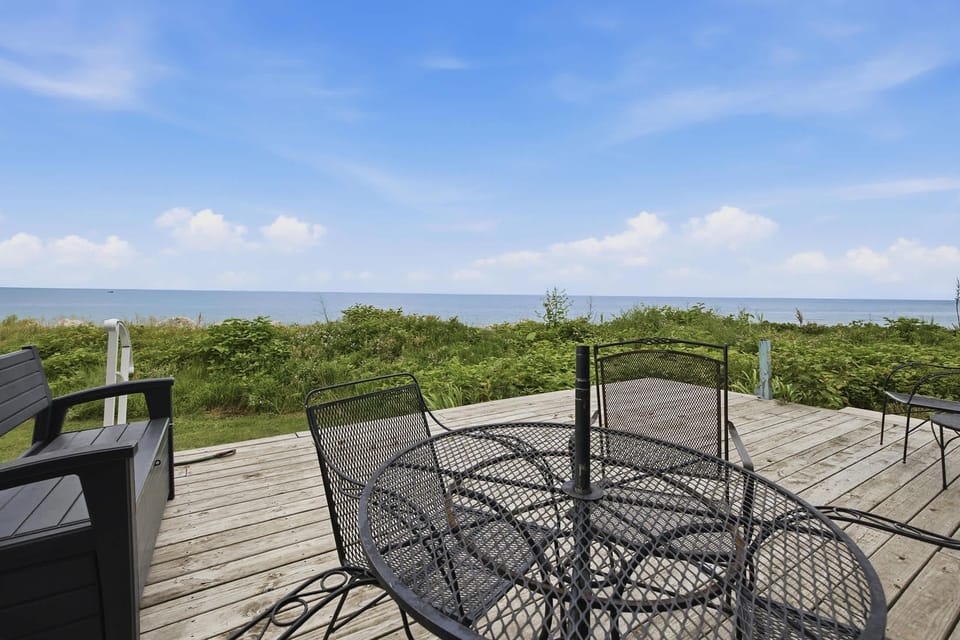 Dine outdoors At Chalet #8 with uninterrupted views of Lake Michigan's shoreline.