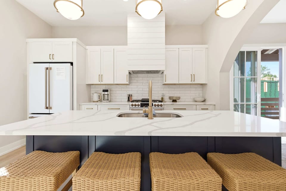 An oversized island keeps cooking, dining, and conversation connected.