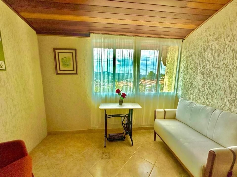 Standard Triple Room | Living area | 20-inch flat-screen TV with satellite channels