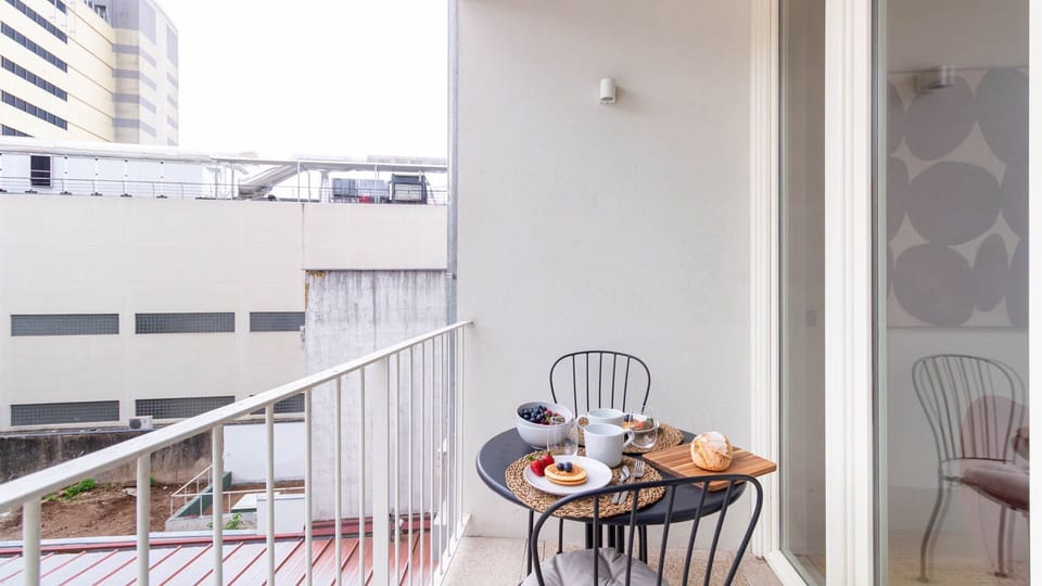 Private balcony set for a relaxed breakfast, perfect for enjoying a quiet morning outdoors. #Balcony #Quiet #Airbnb
