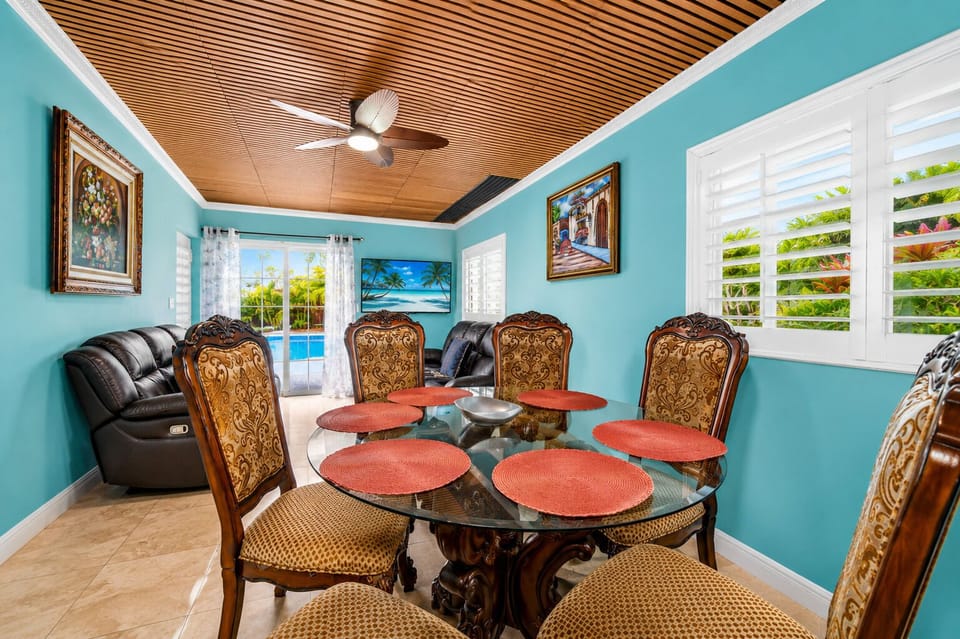 Gather for family meals, celebrations, or game nights in this inviting dining space.