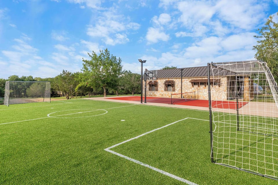  Lace up & get after it — this full turf sport court with soccer goals brings out the competitive side in everyone. 