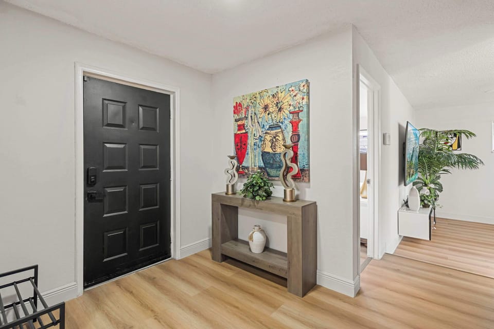 Welcoming entryway with modern console & vibrant artwork