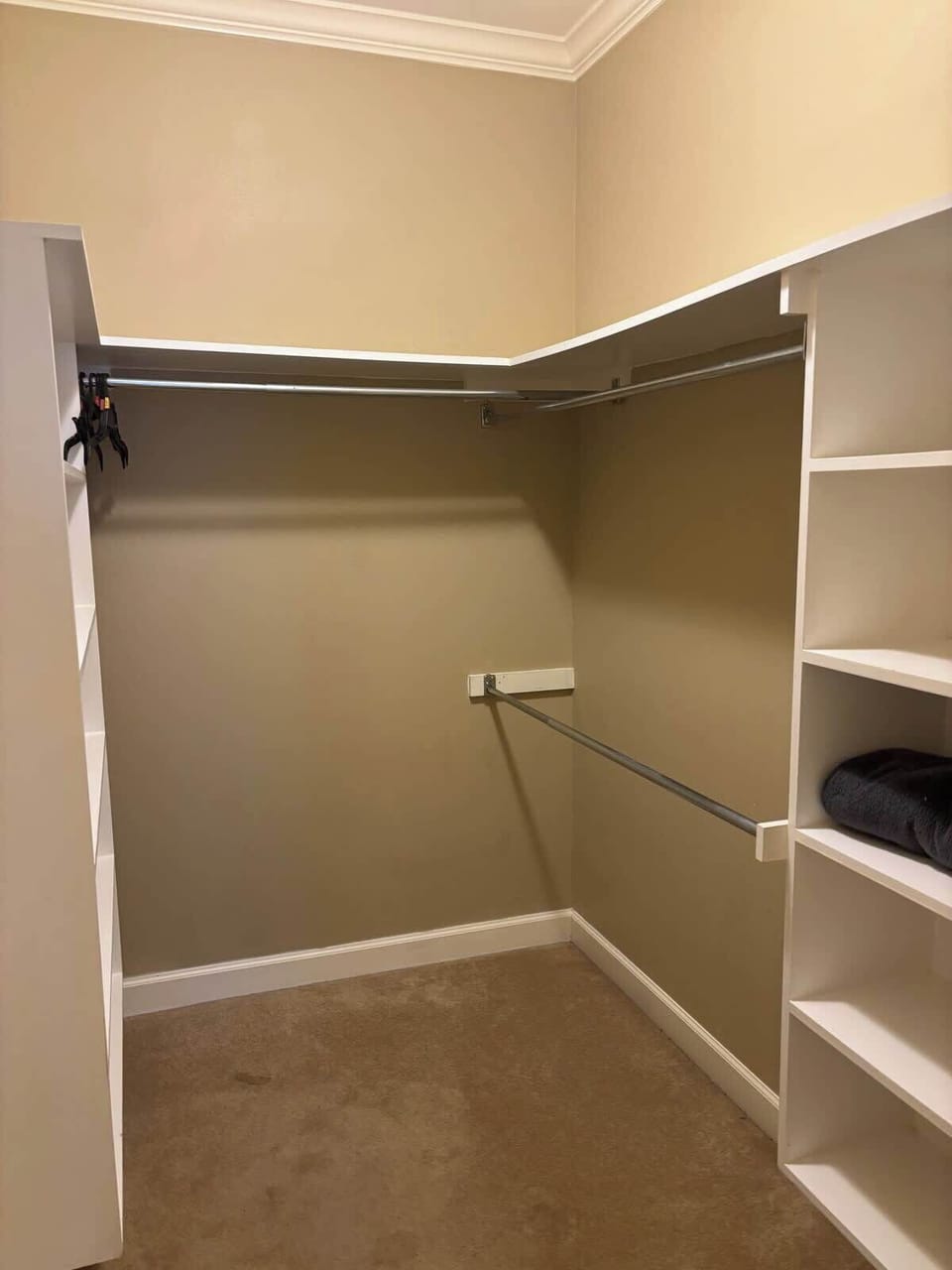 Walk-in closet in master bath area in master bedroom