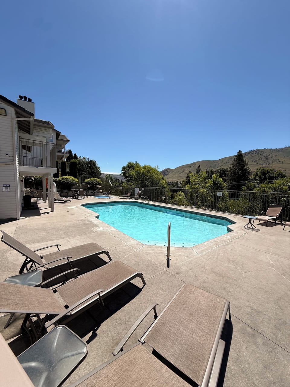 Outdoor Pool with sun loungers and seating 