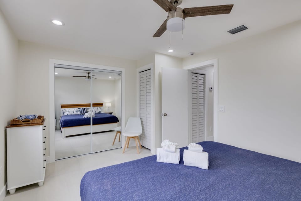 Bedroom with king bed overlooking the serene canal