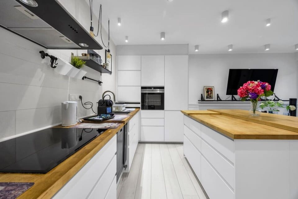 Modern Open-Plan Kitchen with Island, Premium Appliances & Direct Access to the Living Area | Book Now with RENTUJEMY.COM