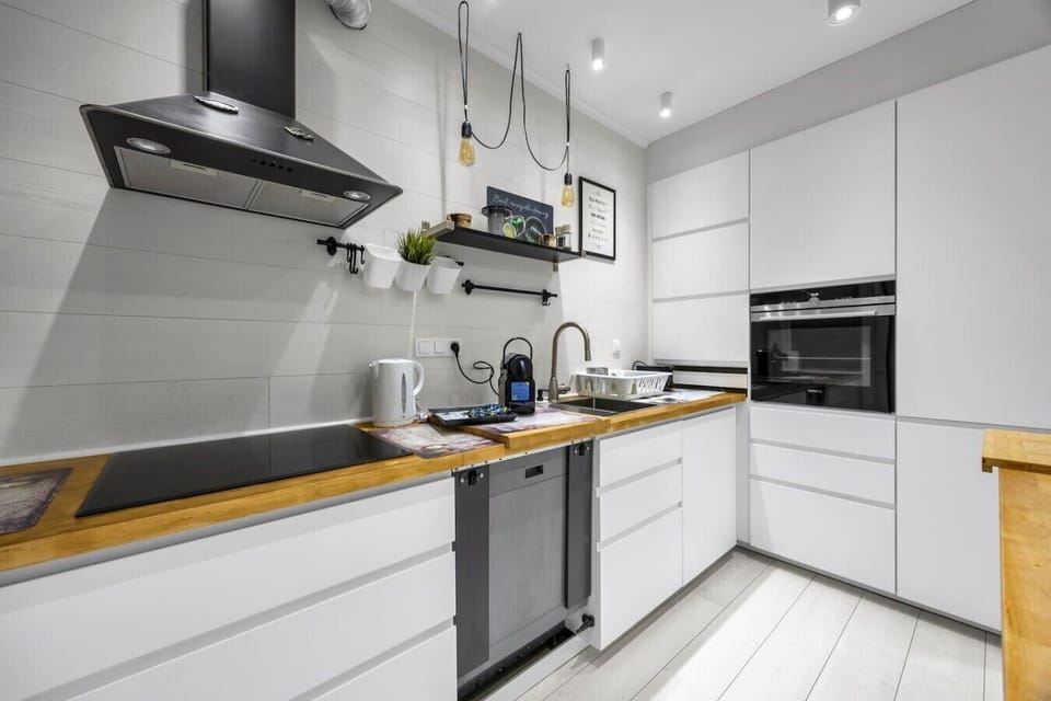 Modern Open-Plan Kitchen with Island, Premium Appliances & Direct Access to the Living Area | Book Now with RENTUJEMY.COM