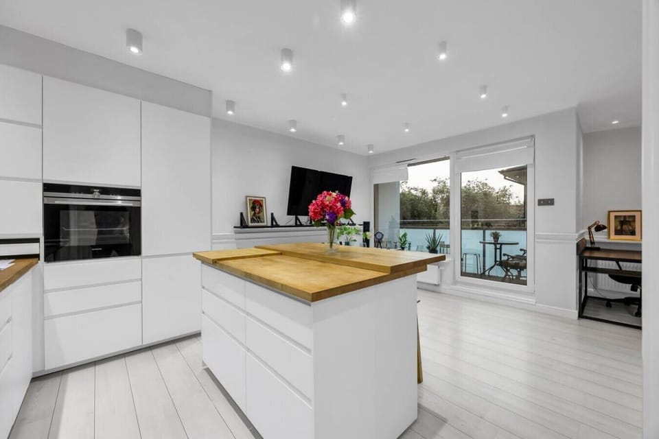 Modern Open-Plan Kitchen with Island, Premium Appliances & Direct Access to the Living Area | Book Now with RENTUJEMY.COM