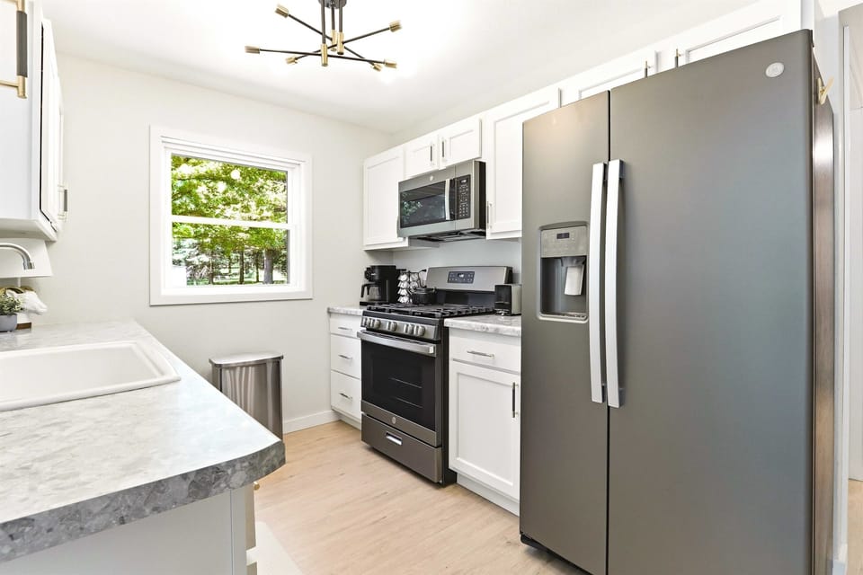Start the day in a sunny, well-equipped kitchen designed for easy meals, coffee refills, and relaxed group stays.