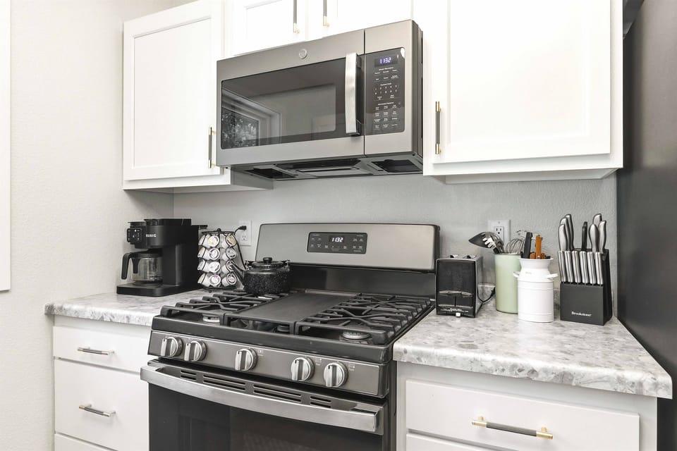 Make mealtime simple with a fully equipped kitchen featuring modern appliances, coffee essentials, and everything you need for easy home-cooked favorites.